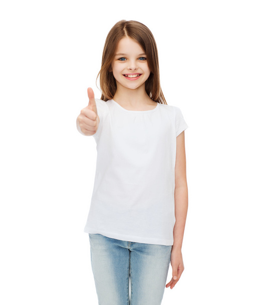 little girl in blank white tshirt showing thumbsup - 写真・画像