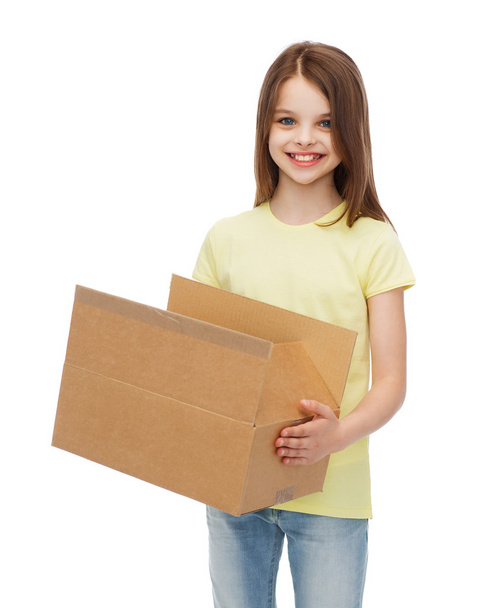 smiling little girl with many cardboard boxes - Foto, imagen