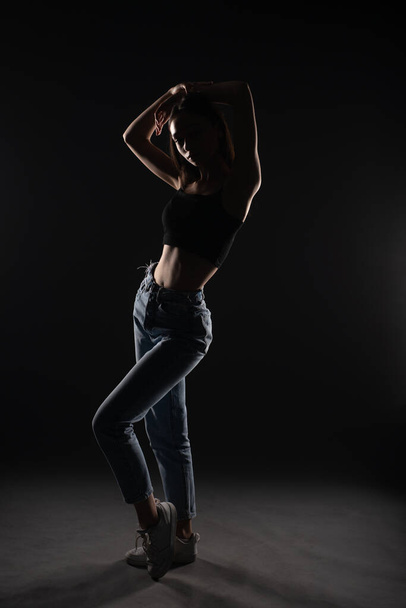 Great posing from silhouette of beautiful and young girl in studio - Zdjęcie, obraz