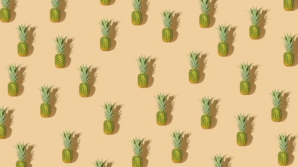 Minimalistic tropical fruit idea with irregular fresh organic pineapple pattern. Creative summer vibes concept, healthy eating and exotic food abstract composition. - Foto, imagen