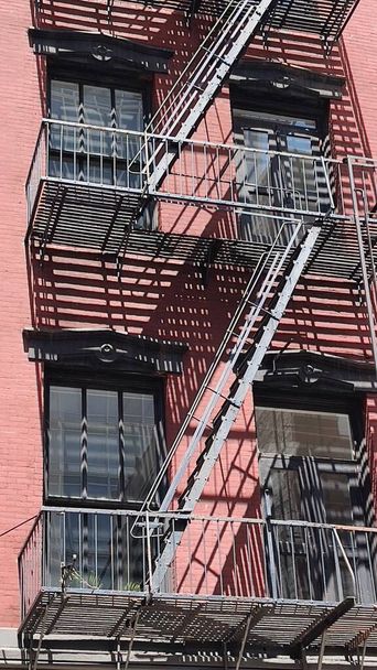 Close-up view of New York City style apartment buildings with emergency stairs SOHO neighborhood of Manhattan, New York, Amerikai Egyesült Államok - Fotó, kép