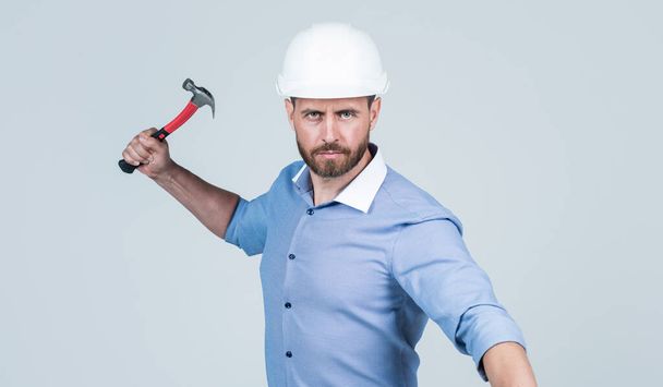 business boss with beard and bristle wear hard hat hold hammer, labor day - Фото, изображение