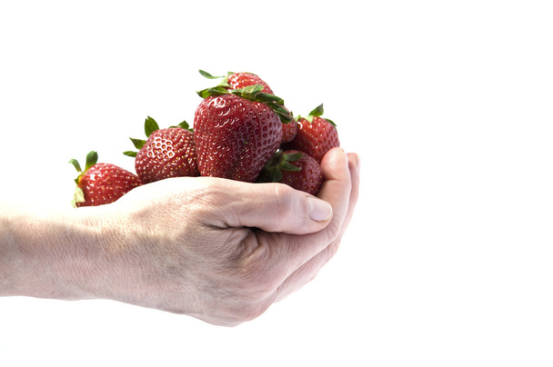 A handful of strawberries - 写真・画像