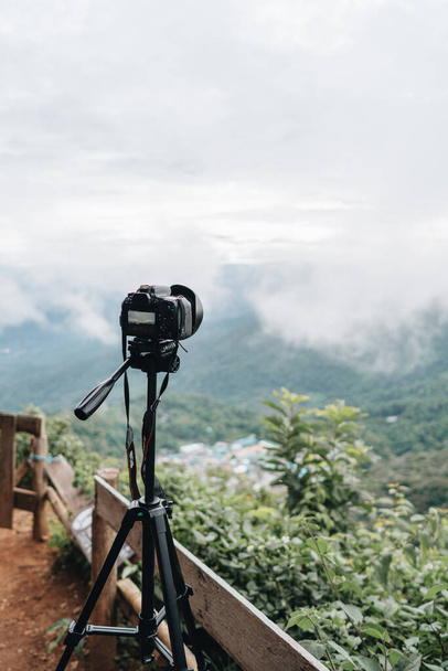 Professional camera making timelapse of Sunset in the Mountains at Doi Pui Viewpoint Doi Suthep-Pui National Park Chiang Mai Northern Thailand. - Photo, image
