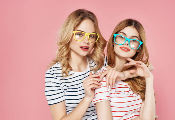 two funny girlfriends with glasses fashionable clothes summer friendship - Фото, зображення