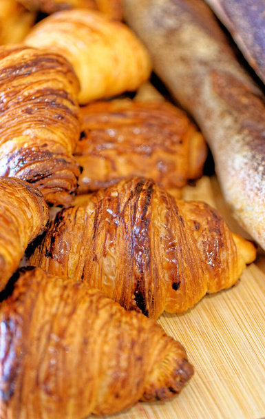 Assortment of Pastries Croissants, Pains au Chocolat and French baguettes - French bakery - Photo, Image