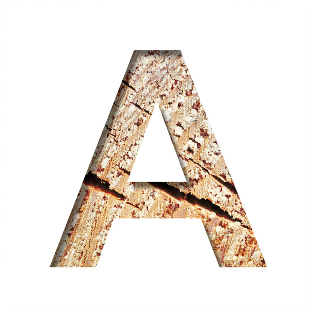 Wood cut font. The letter A cut out of paper on the background of a cut of a tree with cracks and shavings. Set of decorative natural alphabet fonts. - Foto, imagen