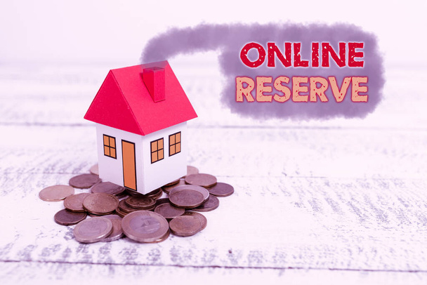 Handwriting text Online Reserve. Business overview enables the customers to book by checking availability Allocating Savings To Buy New Property, Saving Money To Build House - Photo, Image