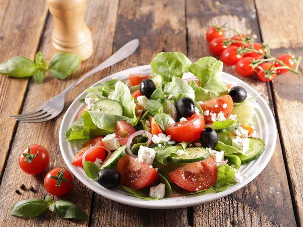 vegetable salad with cucumber,  tomato and olive - Photo, image
