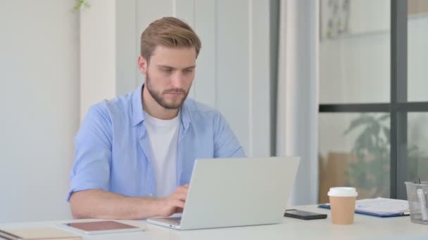 Young Creative Man Working on Laptop in Office  - Footage, Video