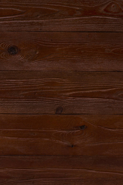 dark brown wooden wall made of planks background - 写真・画像