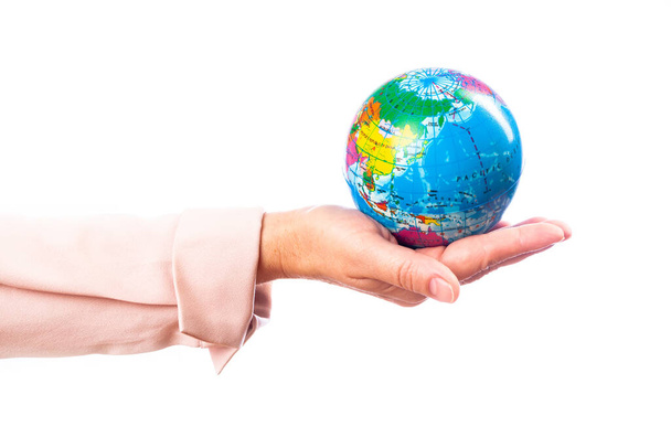 woman holds planet earth in her hand on a white background, isolate - Foto, Imagem