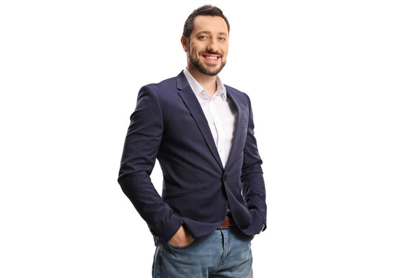Young man in jeans and suit posing with hands in pockets isolated on white background - Foto, Imagem