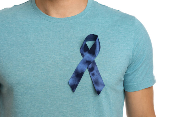 Man with blue ribbon on white background, closeup. Urology cancer awareness - Fotoğraf, Görsel