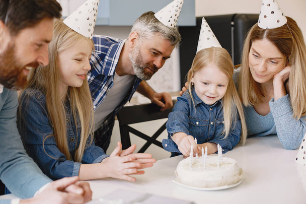 Family celebrating birthday in the kitchen - Photo, Image