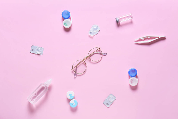 Stylish eyeglasses with contact lenses on color background - Photo, Image