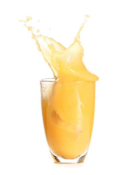 Glass of fresh orange juice with splash on white background - Φωτογραφία, εικόνα