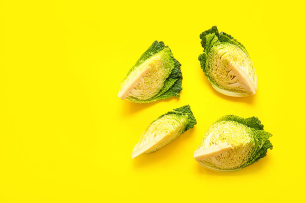 Pieces of fresh savoy cabbage on color background - Photo, Image