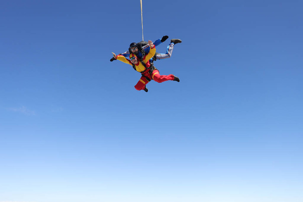 Skydiving. Tandem jump. A spanish woman and her instructor. - Photo, Image