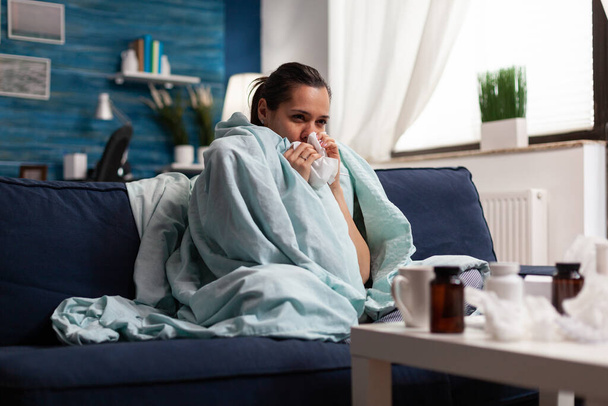 Woman with sickness wrapped in blanket at home ill - Photo, Image