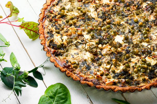 Rural pie with swiss chard, feta cheese and green peas. Pie with herbs, proper nutrition. - Photo, Image