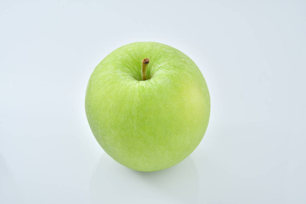 a green apple on a white background - Photo, Image
