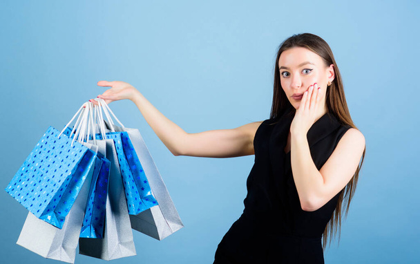 shopping bag. Big sales. fashion and beauty. sensual woman hold purchase package. sexy woman with long hair at shopping. happy birthday surprise present. Heavy bags. Perfect day. Shopaholic - 写真・画像