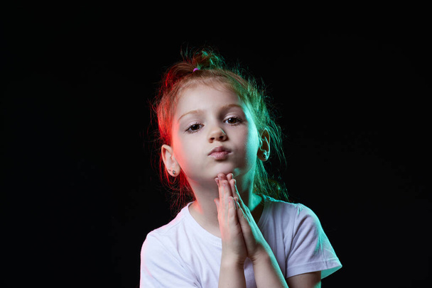 little child girl praying with hands held together - Фото, изображение