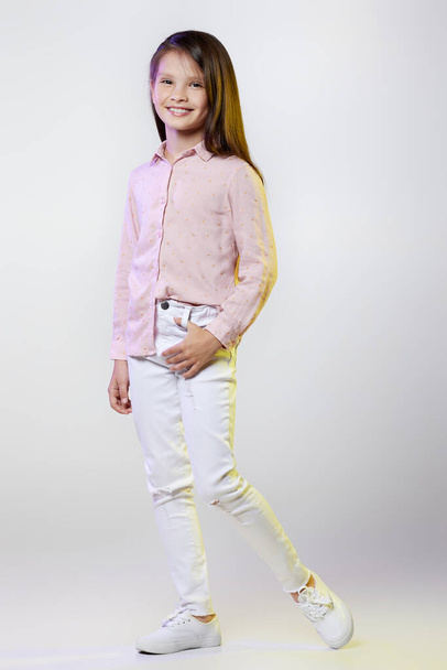 smiling little child girl posing on white background. - Photo, image