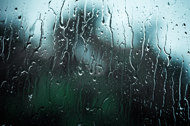 Rain drops on window in summer rainy day - Photo, Image