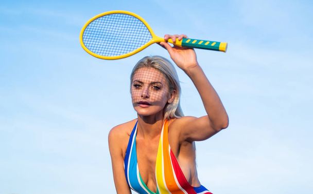 summer activity. active lifestyle. girl in bikini on beach with racket. sportswoman in beachwear. - Foto, afbeelding