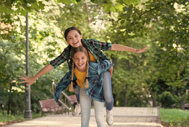 Cool moments. Childhood lifestyle concept. togetherness. happy childrens day. funny time spending. cheerful girls best friends. Wearing denim clothes. girls teenagers spend time together having fun - Fotoğraf, Görsel