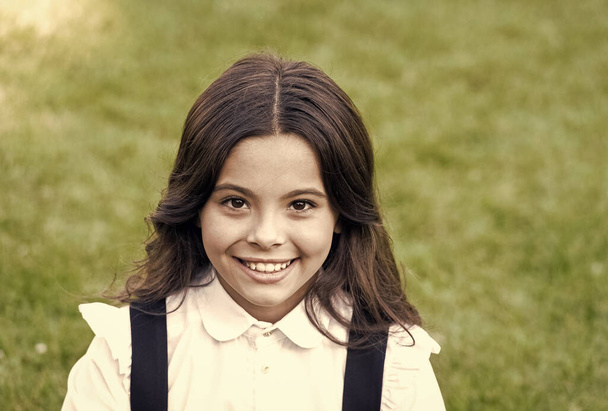Happy kid with cute smile wear classy school uniform formal fashion style natural background, knowlede day, vintage filter - Foto, immagini