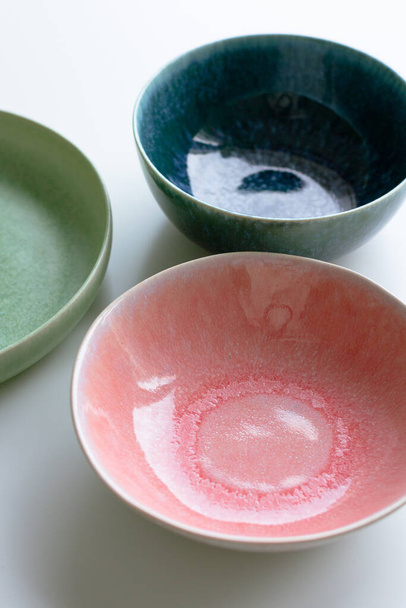 colorful bowls on white background, copy space - Foto, Imagem
