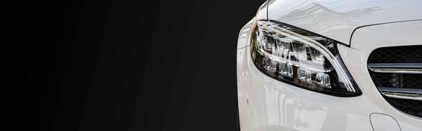 Close - up Modern white car headlights isolated on black background - Photo, Image