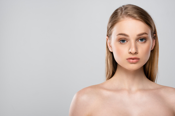 young woman with bare shoulders and blue eyes isolated on grey - Foto, Imagem