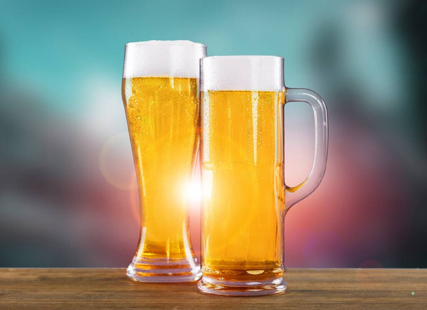 Big two glass of beer clinking at outdoor bar or pub - Photo, Image