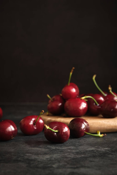 ripe cherries on a dark background - Photo, Image