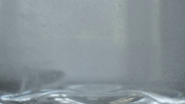 Half tablet dose dropped in water glass - Footage, Video