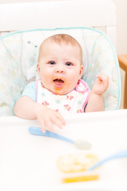 Baby girl in high chair - Photo, image