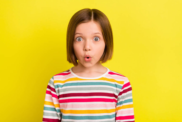 Photo of amazed shocked young little girl reaction news face sale isolated on shine yellow color background - Foto, Imagen