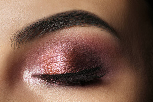 Young woman with evening makeup, closeup. Eye shadow product - Photo, Image