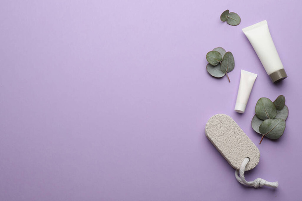 Flat lay composition with pumice stone on violet background. Space for text - Foto, afbeelding