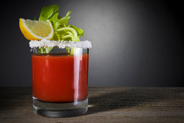 Bloody Mary cocktail with celery and lemon - Foto, imagen