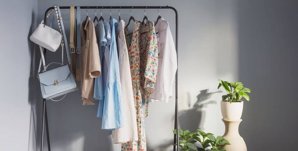 light colored womens summer clothes and shoes on  hanger - Valokuva, kuva