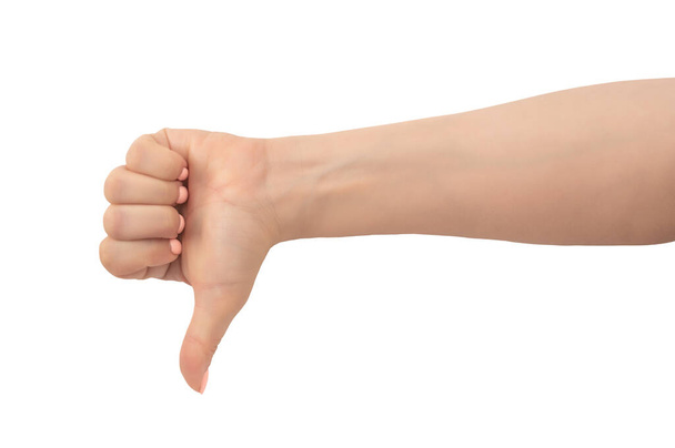 Woman hand thumb down sign isolated on white background. caucasian female hand with thumbs up gesture. Close-up female hand gesture dislike, bad, disapproval isolated on white background - Foto, immagini