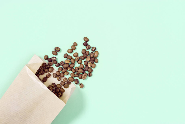 Roasted coffee beans in craft paper package mock up. Shopping at a coffee shop. Social media content. - Фото, изображение