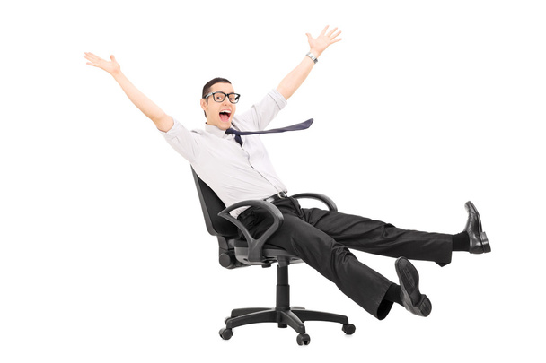 Man riding in office chair - Foto, Bild