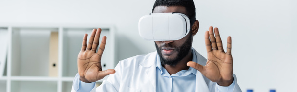 African american doctor using vr headset in clinic, banner  - Фото, зображення