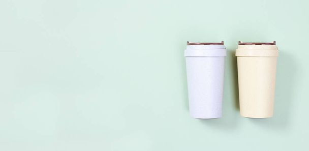 Reusable eco coffee cup. Zero waste concept, flat lay. Ban single use plastic. Take away big mug for drinks. Bammer with copy space. - Foto, Imagen